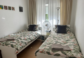 Twin room with shared bathroom