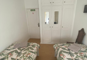 Twin room with shared bathroom