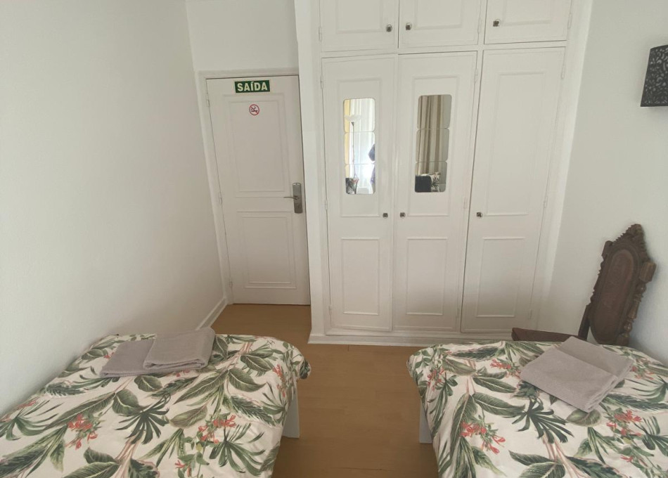 Twin room with shared bathroom